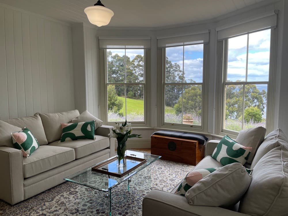 Rural Tasmania accommodation - living room with bay windows at Flowerpot